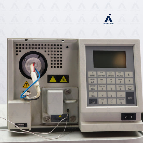 Photo of a Waters 2487 UV Detector. Open front panel cover showing internal components.