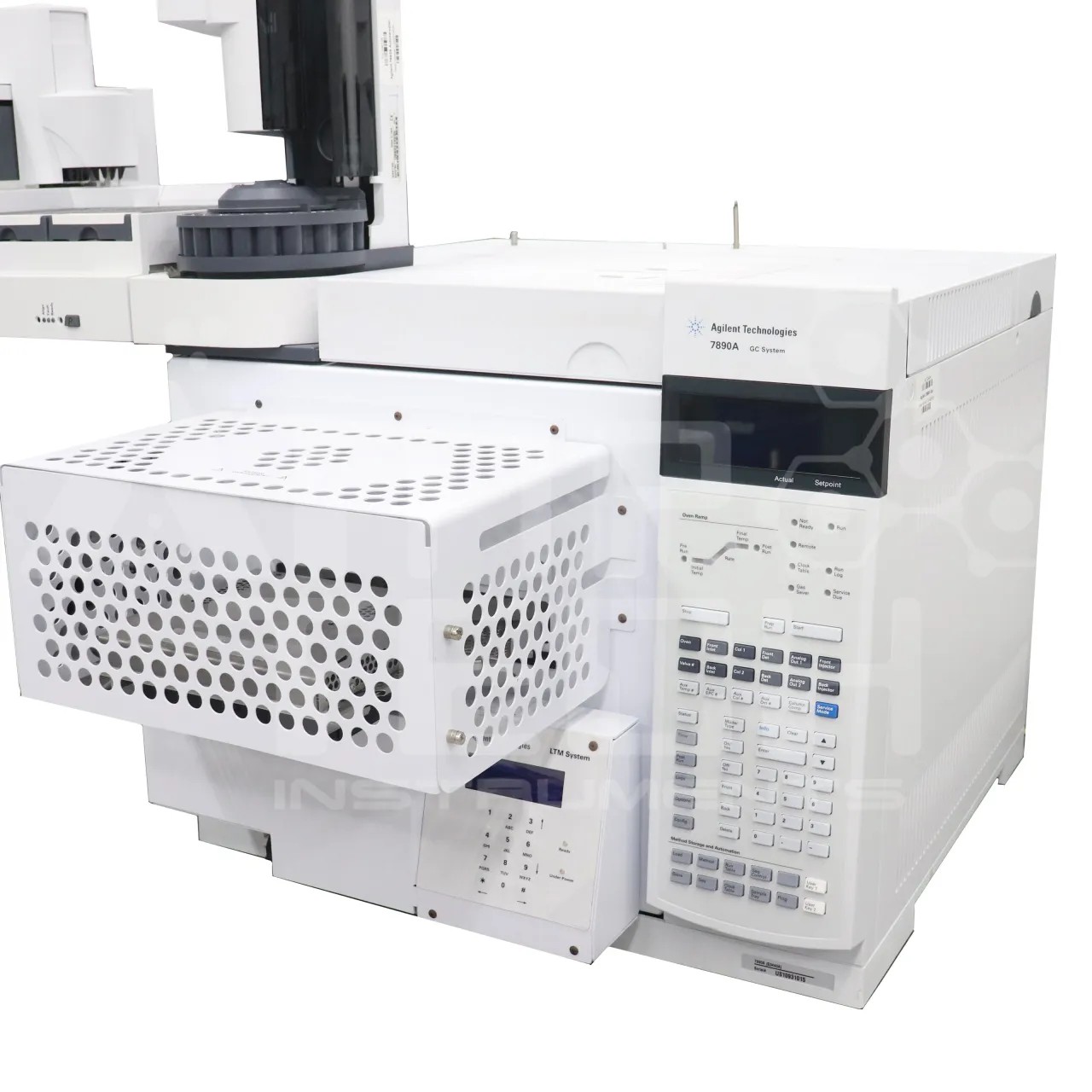 Close-up of an Agilent 7890A GC keypad and oven on white